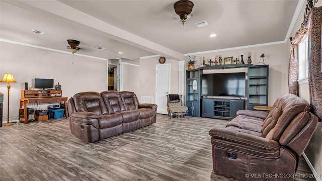 living room with crown molding, wood-type flooring, and ceiling fan