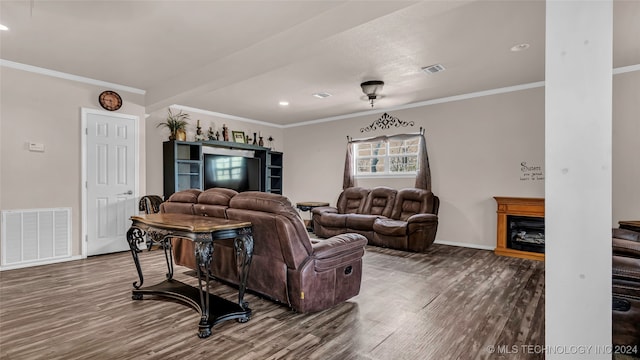 living room featuring crown molding and hardwood / wood-style floors