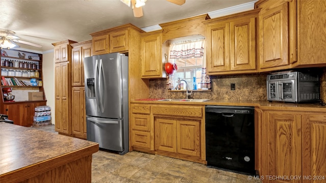 kitchen with ceiling fan, black dishwasher, sink, and stainless steel fridge