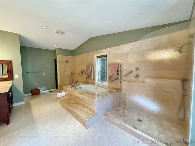 bathroom with vanity, tile patterned floors, vaulted ceiling, and shower with separate bathtub