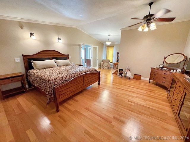 bedroom with light hardwood / wood-style floors, ornamental molding, vaulted ceiling, and ceiling fan