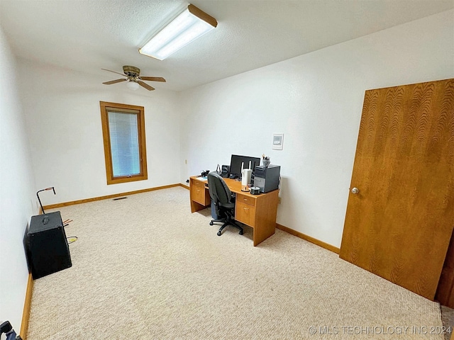 office featuring ceiling fan, a textured ceiling, and carpet floors