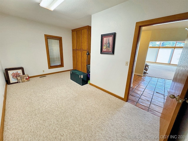 interior space featuring a textured ceiling