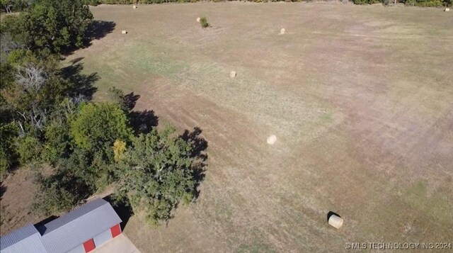 birds eye view of property featuring a rural view