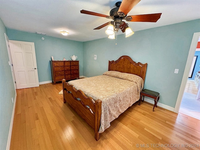 bedroom featuring light wood-type flooring and ceiling fan