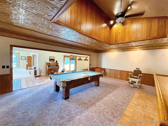 recreation room with a wealth of natural light, a high ceiling, billiards, and wood walls