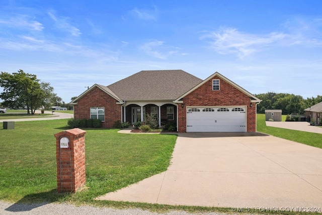 view of front of house with a front yard and a garage