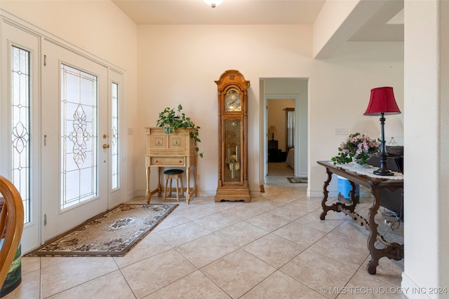 foyer featuring a healthy amount of sunlight and light tile patterned floors