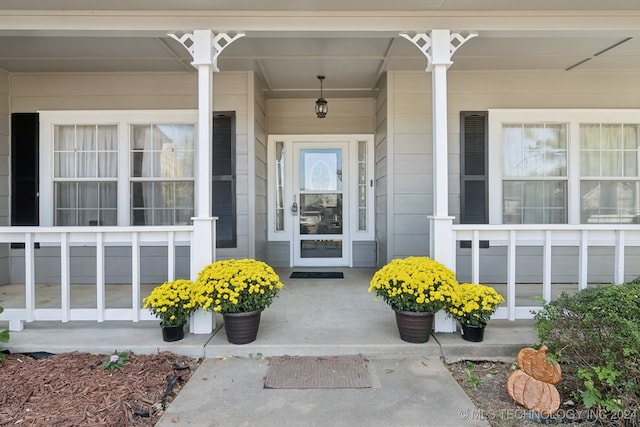 property entrance featuring covered porch