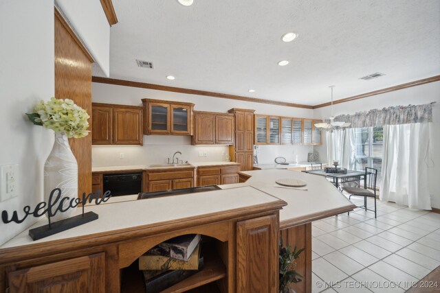 kitchen featuring sink, dishwasher, crown molding, light tile patterned floors, and an inviting chandelier