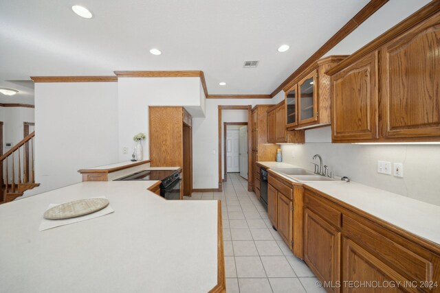 kitchen with black dishwasher, ornamental molding, light tile patterned flooring, electric stove, and sink