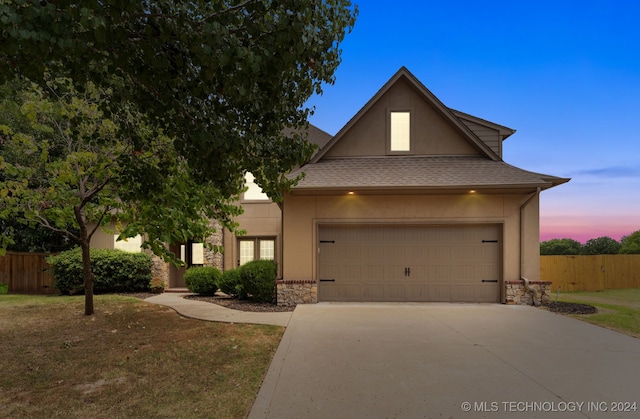 view of front of property with a garage