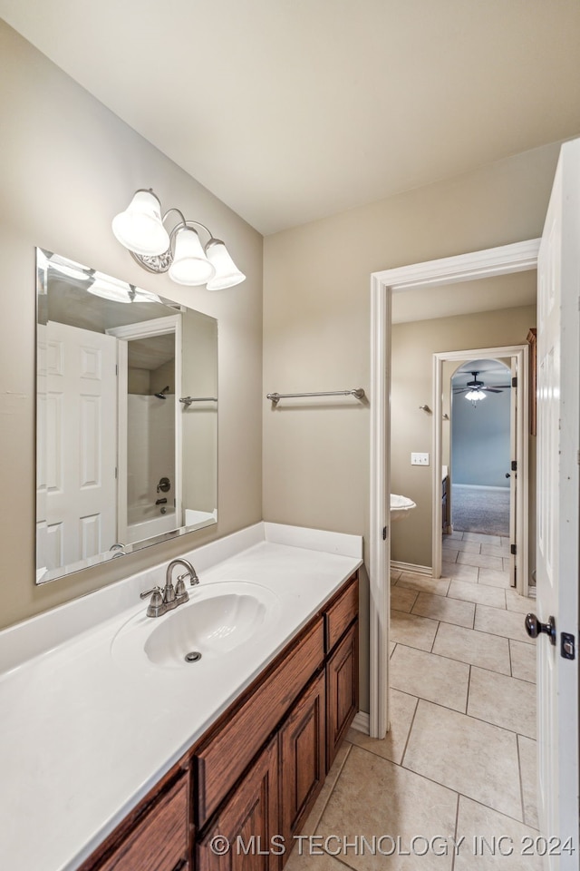 bathroom featuring vanity, tile patterned flooring, and ceiling fan