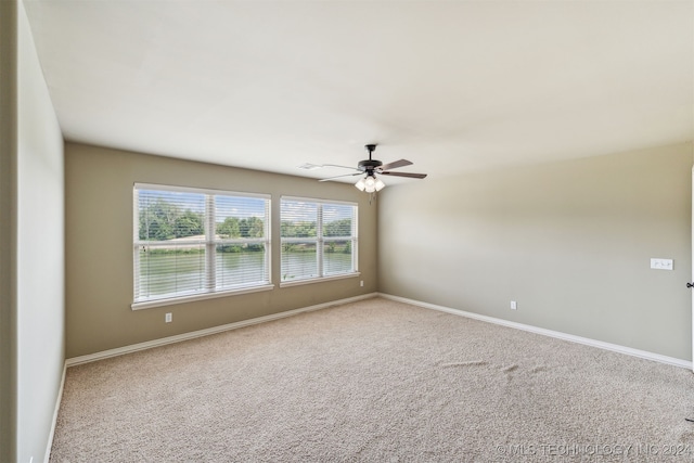 carpeted empty room with ceiling fan