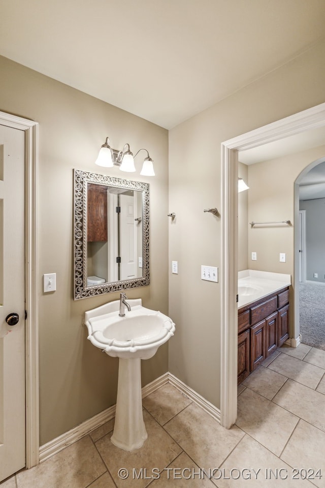 bathroom with tile patterned flooring