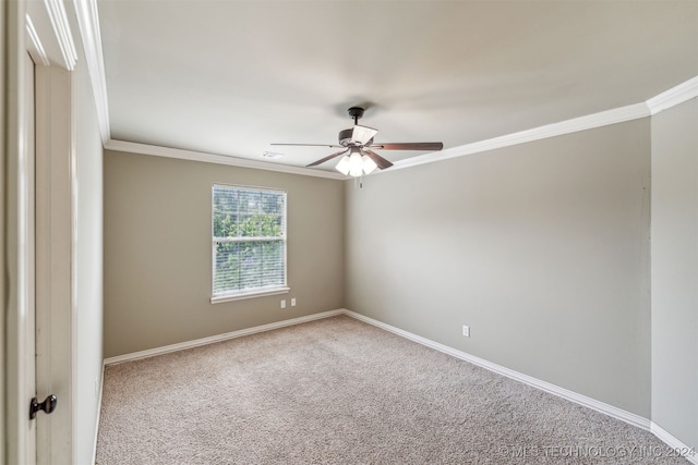 carpeted spare room featuring crown molding and ceiling fan