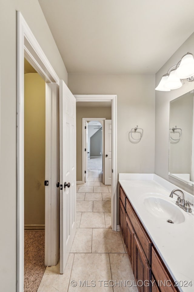 bathroom with vanity and tile patterned flooring