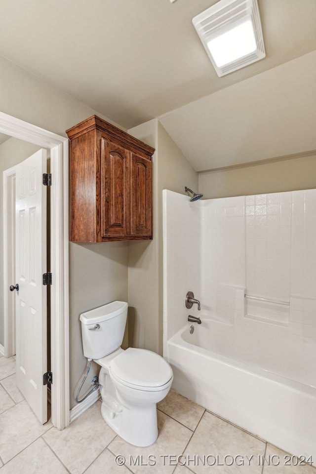 bathroom with tile patterned floors, shower / tub combination, and toilet