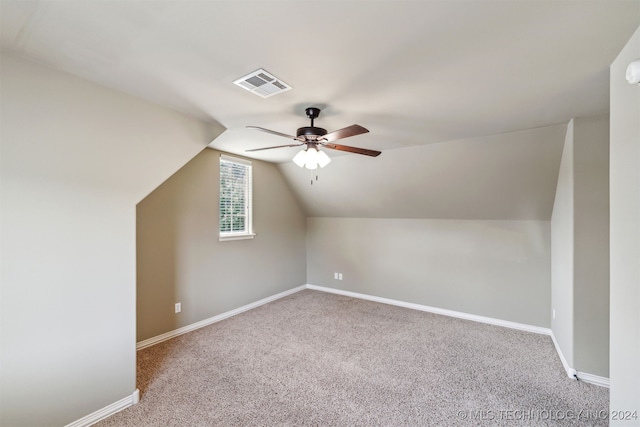 bonus room with ceiling fan, carpet flooring, and lofted ceiling