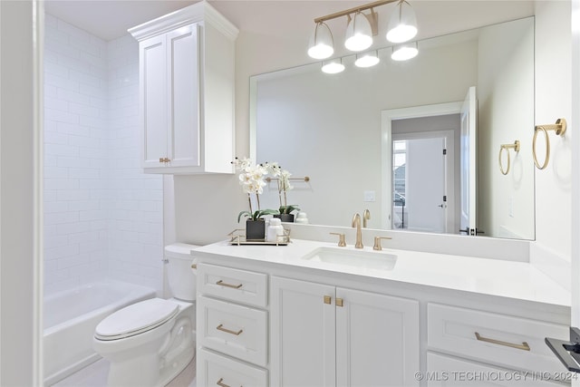 full bathroom featuring vanity, tiled shower / bath combo, and toilet