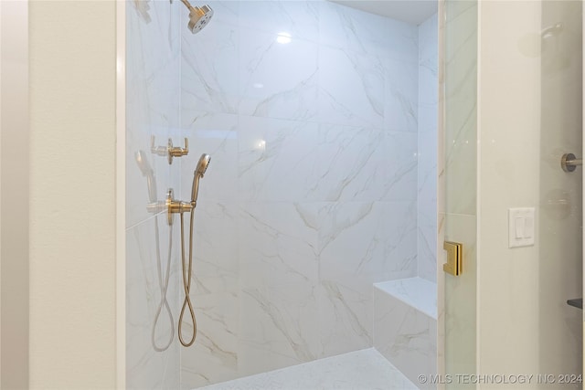 bathroom with a shower with shower door