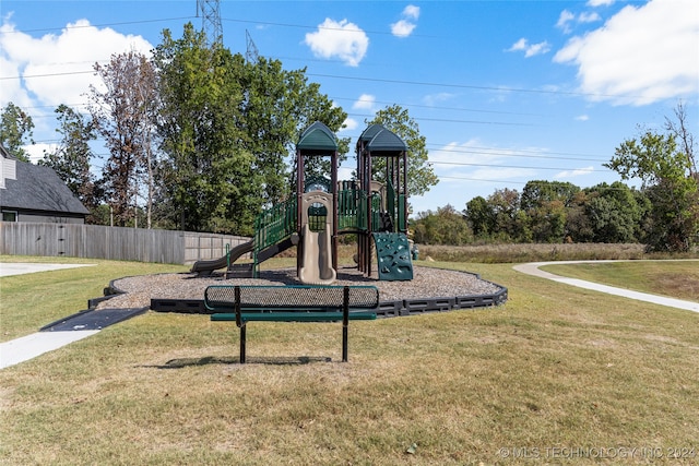 view of jungle gym with a lawn