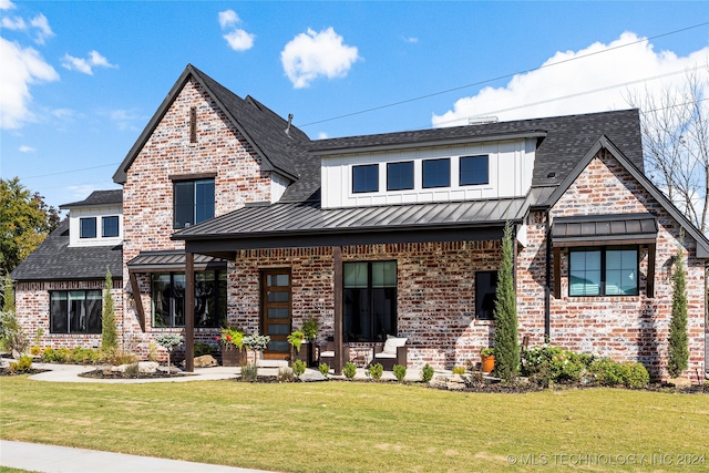 view of front of house with a front lawn