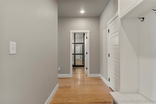 corridor featuring light hardwood / wood-style flooring