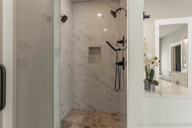 bathroom with tiled shower