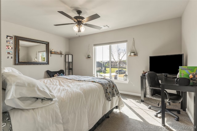 bedroom featuring light colored carpet and ceiling fan