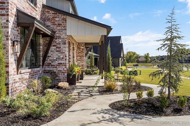 doorway to property with a yard