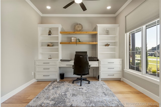 home office with ornamental molding, light hardwood / wood-style flooring, and ceiling fan