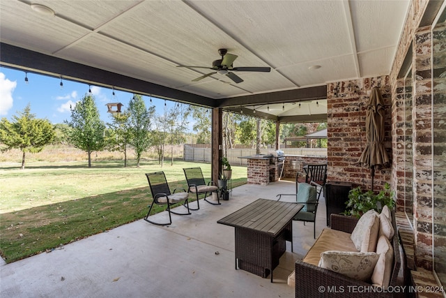 view of patio / terrace with an outdoor living space and ceiling fan