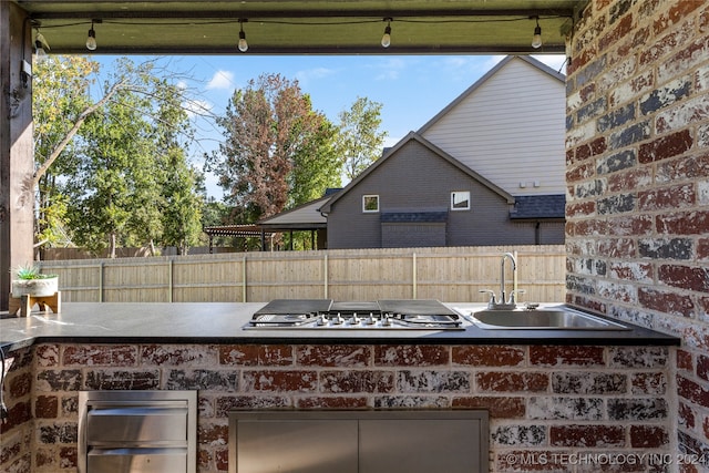 view of patio featuring sink and an outdoor kitchen