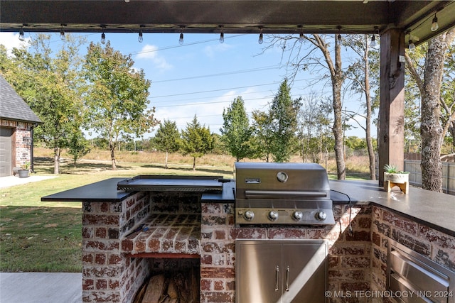 view of patio featuring a grill and exterior kitchen