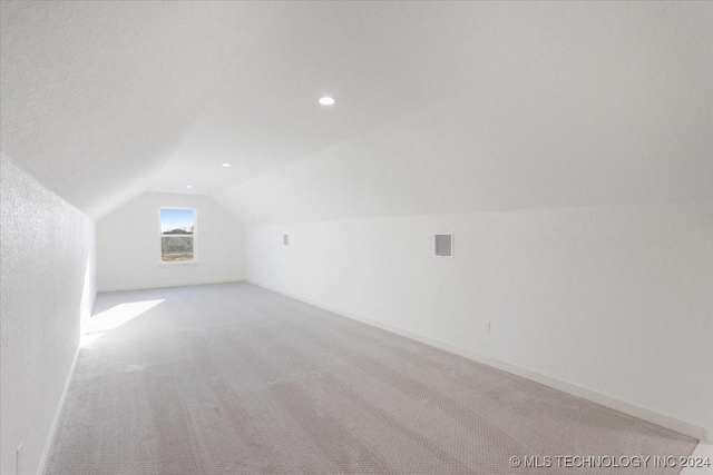 849 Springfield Ct, Durant, OK 74701 - bonus room with lofted ceiling, light carpet, baseboards, and recessed lighting