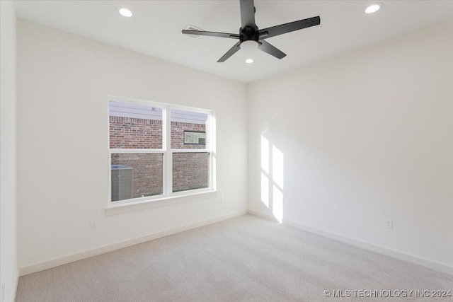 unfurnished room with light carpet and ceiling fan