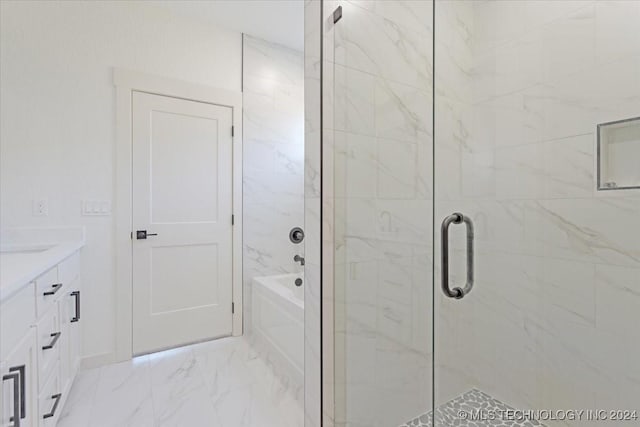 849 Springfield Ct, Durant, OK 74701 - bathroom with a shower stall, a tub to relax in, marble look tile flooring, and vanity