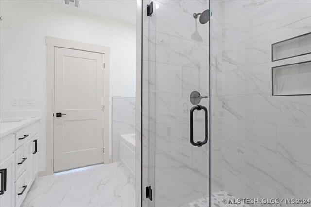 845 Springfield Ct, Durant, OK 74701 - full bathroom with a marble finish shower, vanity, marble look tile flooring, and a garden tub