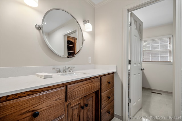 bathroom with vanity and ornamental molding