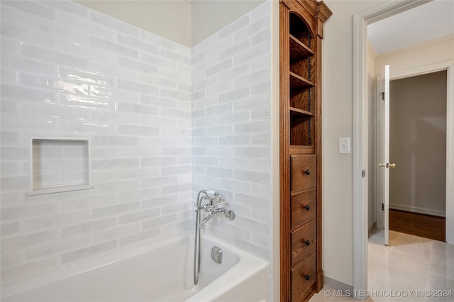 bathroom featuring a tub to relax in and tile patterned floors