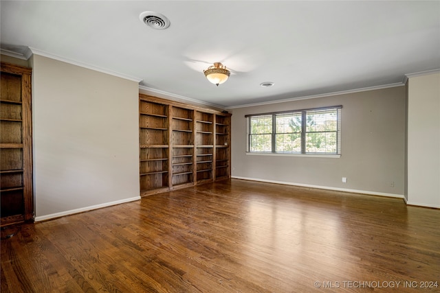 unfurnished room with crown molding and dark hardwood / wood-style flooring