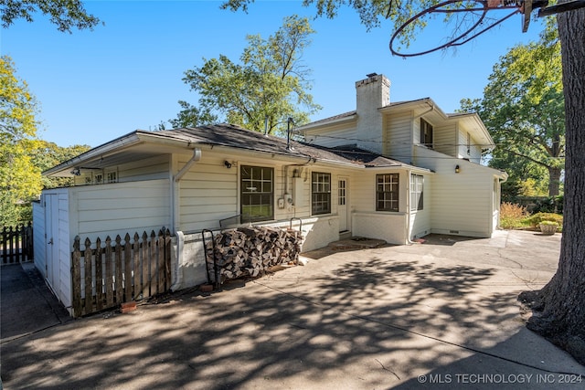 rear view of property featuring a patio