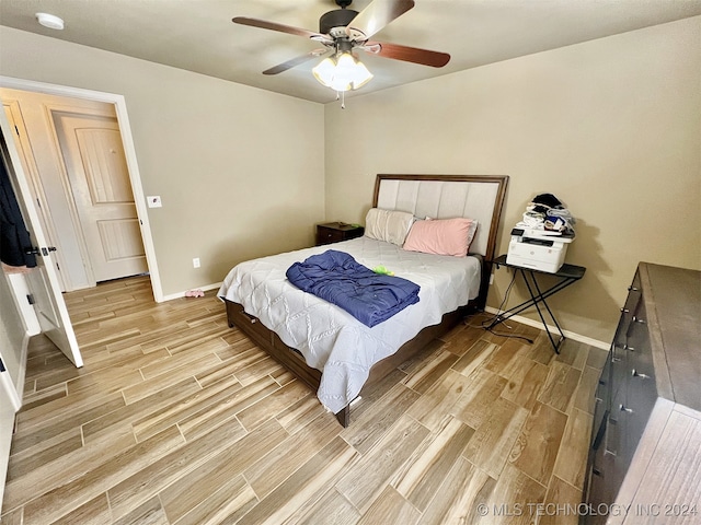 bedroom featuring light hardwood / wood-style flooring and ceiling fan