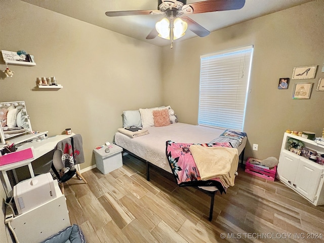 bedroom with light wood-type flooring and ceiling fan