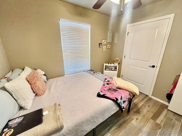 bedroom featuring wood-type flooring and ceiling fan