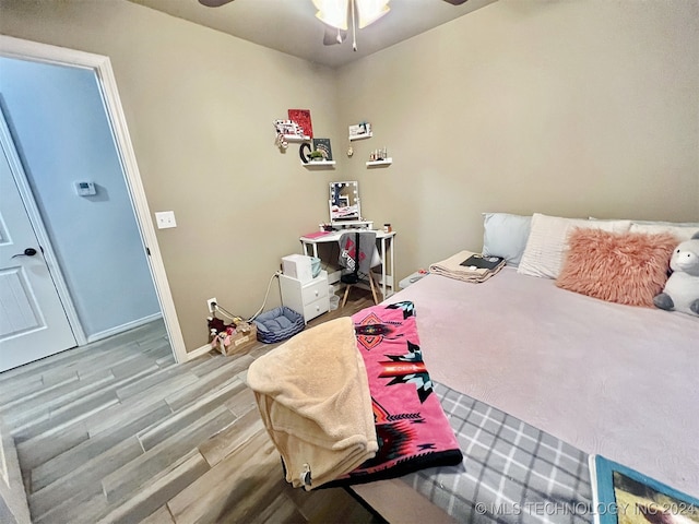 bedroom featuring hardwood / wood-style flooring and ceiling fan