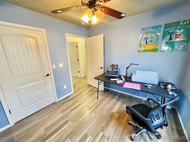 office featuring light hardwood / wood-style flooring and ceiling fan