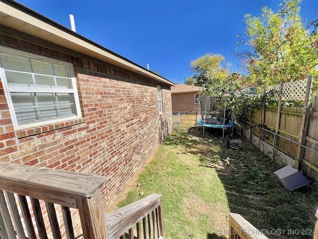 view of yard featuring a trampoline