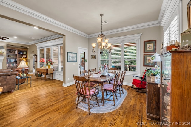 dining space featuring crown molding and hardwood / wood-style floors